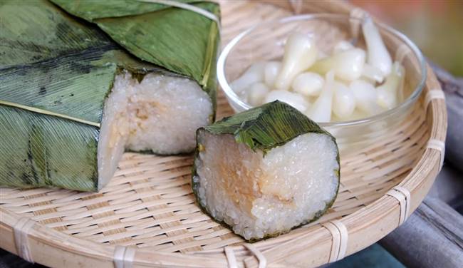 Bánh chưng là một trong những món ăn truyền thống không thể thiếu trong Tết Việt - Ảnh: ALAMY